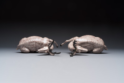 A pair of Chinese aubergine-glazed models of recumbent deer, 18/19th C.