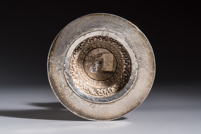A Tibetan ritual jade bowl with a red coral-mounted silver cover and a stand, 19th C.