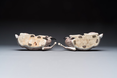 A pair of Chinese aubergine-glazed models of recumbent deer, 18/19th C.