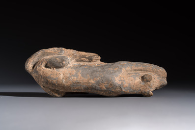 A Chinese grey pottery model of a reclining dog, Han