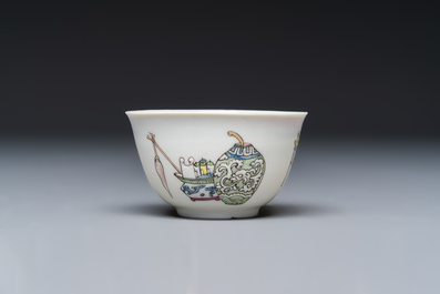 A fine Chinese famille rose 'Court Lady and a Boy' cup and saucer, Yongzheng