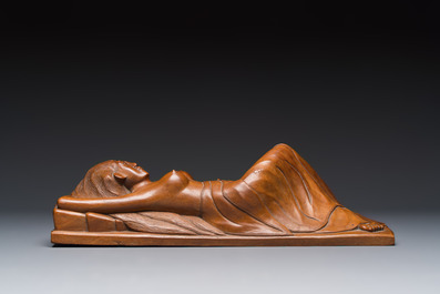 A Balinese carved wooden sculpture of a reclining lady, first half 20th C.
