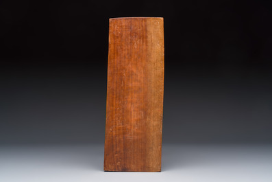 A Balinese carved wooden sculpture of a reclining lady, first half 20th C.