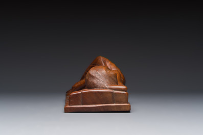 A Balinese carved wooden sculpture of a reclining lady, first half 20th C.