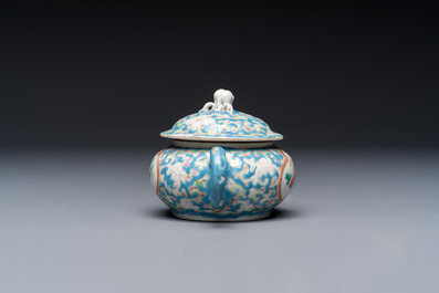 Three Chinese famille rose blue- and yellow-ground teapots and covers for the Straits or Peranakan market, Tongzhi marks, 19th C.