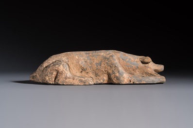 A Chinese grey pottery model of a reclining dog, Han