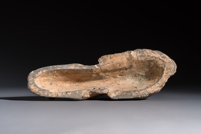 A Chinese grey pottery model of a reclining dog, Han
