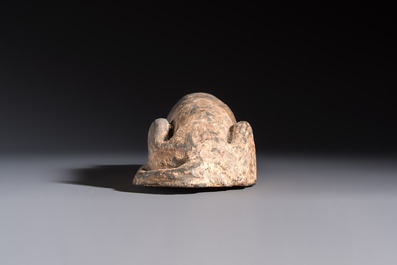 A Chinese grey pottery model of a reclining dog, Han