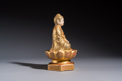 A Japanese Satsuma figure of Buddha seated on a lotus base, Hododa 保土田 mark, Meiji, 19/20th C.