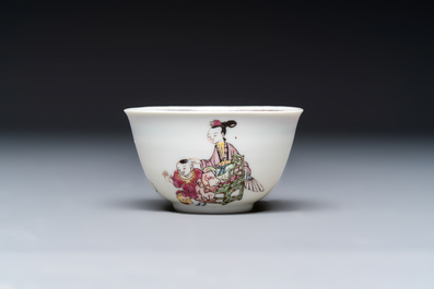 A fine Chinese famille rose 'Court Lady and a Boy' cup and saucer, Yongzheng