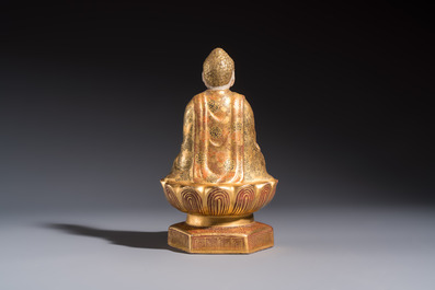 A Japanese Satsuma figure of Buddha seated on a lotus base, Hododa 保土田 mark, Meiji, 19/20th C.