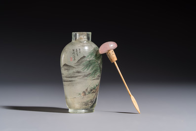 A Chinese inside-painted glass snuff bottle with two men wearing straw raincoats, dated 1911