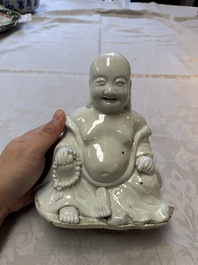 A Chinese white-glazed Milefo Buddha, 19th C.