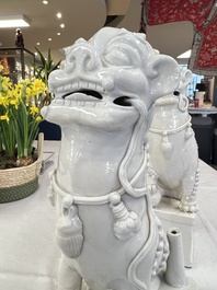 A pair of large Chinese Dehua blanc de Chine Buddhist lion joss stick holders, 19th C.