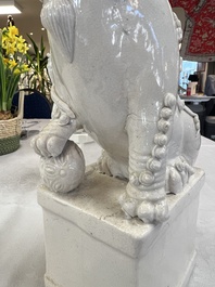 A pair of large Chinese Dehua blanc de Chine Buddhist lion joss stick holders, 19th C.