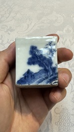 A Chinese blue and white 'Mountainous Landscape' writing set with an inkwell, sander and candlestick, Qianlong