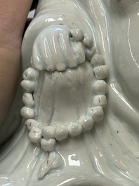 A Chinese white-glazed Milefo Buddha, 19th C.