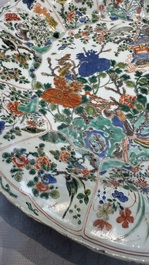 A large Chinese famille verte 'Pavilion with Birds among Flowering Branches' dish, Kangxi