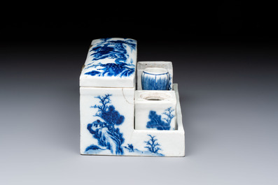 A Chinese blue and white 'Mountainous Landscape' writing set with an inkwell, sander and candlestick, Qianlong