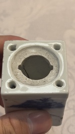 A Chinese blue and white 'Mountainous Landscape' writing set with an inkwell, sander and candlestick, Qianlong