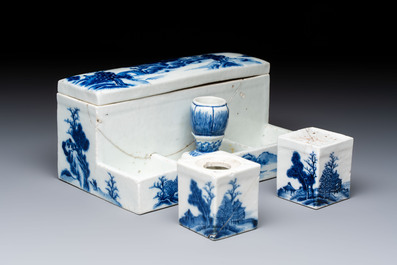 A Chinese blue and white 'Mountainous Landscape' writing set with an inkwell, sander and candlestick, Qianlong