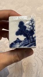 A Chinese blue and white 'Mountainous Landscape' writing set with an inkwell, sander and candlestick, Qianlong