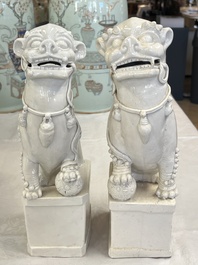 A pair of large Chinese Dehua blanc de Chine Buddhist lion joss stick holders, 19th C.