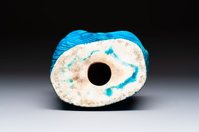 A Chinese turquoise-glazed Guanyin, a white-glazed bottle vase and a blue and white jar, 19th C.
