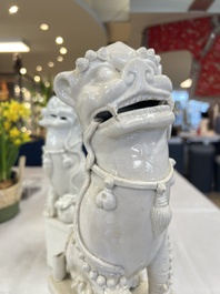 A pair of large Chinese Dehua blanc de Chine Buddhist lion joss stick holders, 19th C.