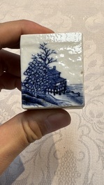 A Chinese blue and white 'Mountainous Landscape' writing set with an inkwell, sander and candlestick, Qianlong