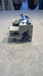 A Chinese blue and white 'Mountainous Landscape' writing set with an inkwell, sander and candlestick, Qianlong