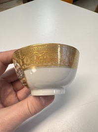 A pair of Chinese gilt-decorated sepia 'Riverscape' cups and saucers, Jiaqing
