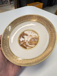 A pair of Chinese gilt-decorated sepia 'Riverscape' cups and saucers, Jiaqing