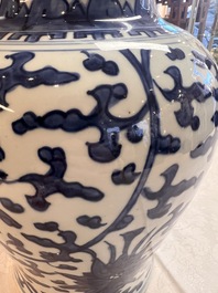 Two Chinese blue and white 'Lotus Scroll' vases and covers, Kangxi