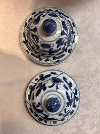 Two Chinese blue and white 'Lotus Scroll' vases and covers, Kangxi