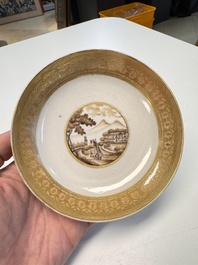 A pair of Chinese gilt-decorated sepia 'Riverscape' cups and saucers, Jiaqing