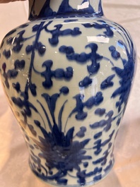 Two Chinese blue and white 'Lotus Scroll' vases and covers, Kangxi