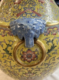 A pair of large Chinese famille rose yellow-ground 'Hu' vases with narrative design, Qianlong mark, Republic