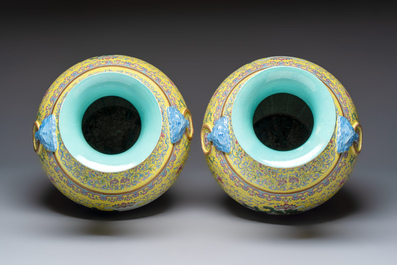 A pair of large Chinese famille rose yellow-ground 'Hu' vases with narrative design, Qianlong mark, Republic