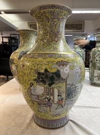 A pair of large Chinese famille rose yellow-ground 'Hu' vases with narrative design, Qianlong mark, Republic