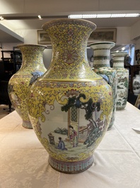 A pair of large Chinese famille rose yellow-ground 'Hu' vases with narrative design, Qianlong mark, Republic