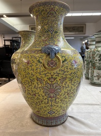 A pair of large Chinese famille rose yellow-ground 'Hu' vases with narrative design, Qianlong mark, Republic