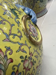 A pair of large Chinese famille rose yellow-ground 'Hu' vases with narrative design, Qianlong mark, Republic