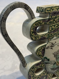 A pair of Chinese verte biscuit 'Shou' wine ewers, 19th C.
