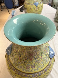 A pair of large Chinese famille rose yellow-ground 'Hu' vases with narrative design, Qianlong mark, Republic