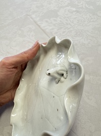 A Chinese Dehua blanc de Chine 'Lotus Leaf and Frog' brush washer on a wooden stand, Kangxi/Yongzheng