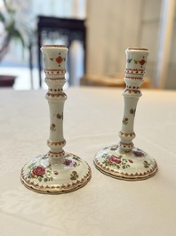 A pair of Chinese famille rose candlesticks with floral design, Qianlong
