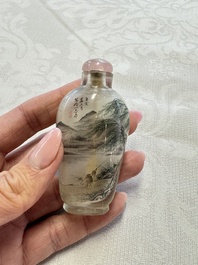 A Chinese inside-painted glass snuff bottle with two men wearing straw raincoats, dated 1911