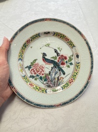 A pair of Chinese famille rose 'Peacock and Flowers' plates, Yongzheng
