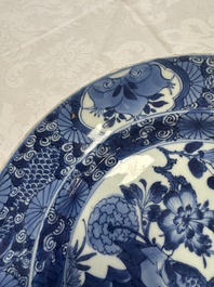 A Chinese blue and white dish with floral design and a famille rose 'HeHe Erxian' plate, Kangxi/Yongzheng